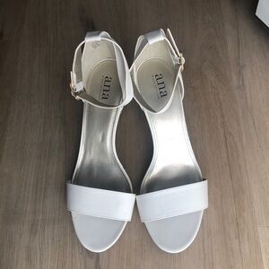 Woman’s kitten heels. White